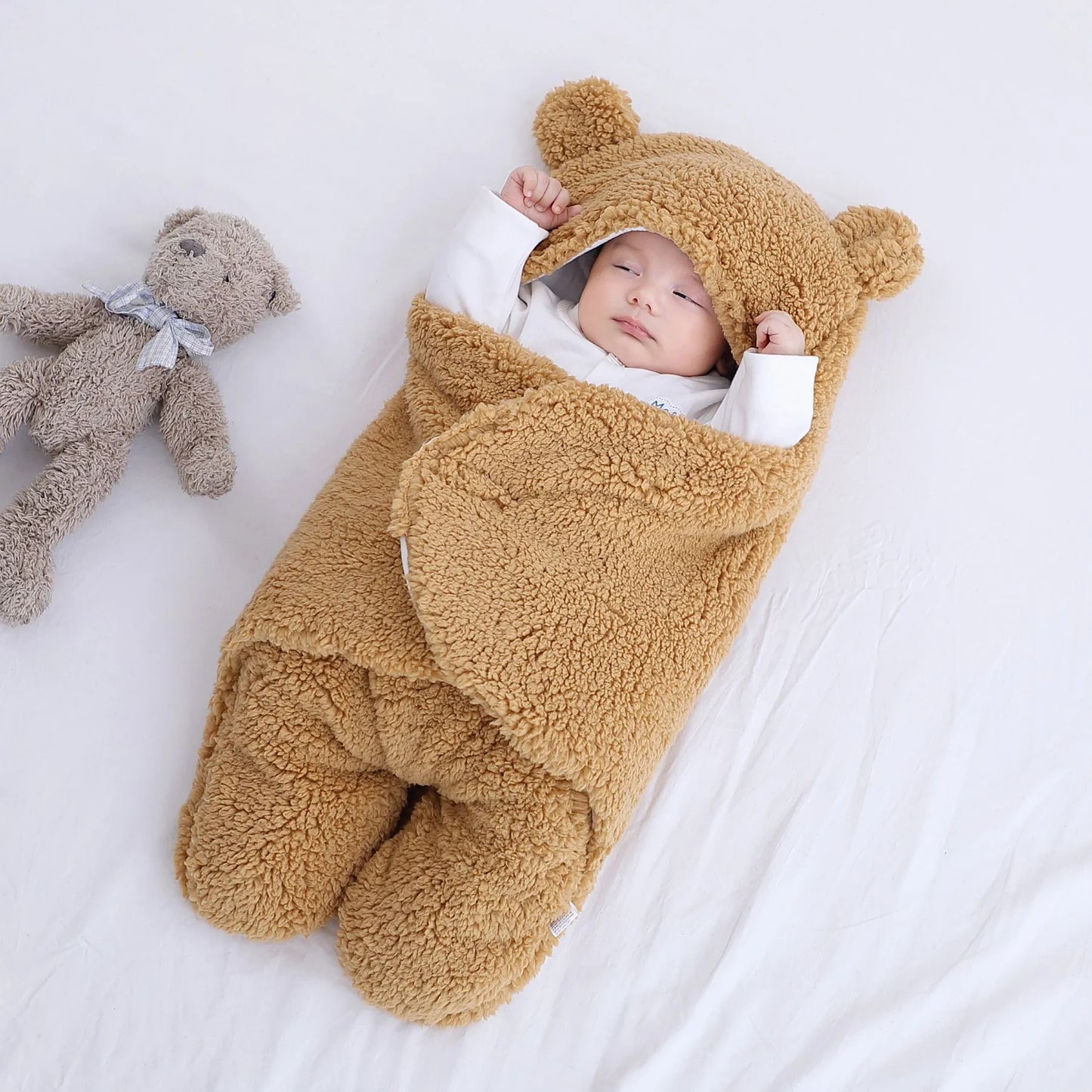 Cute and cuddly Khaki brown baby bear blanket with baby wrapped up cozy with arms outstretched versatile for baby's temperature comfort