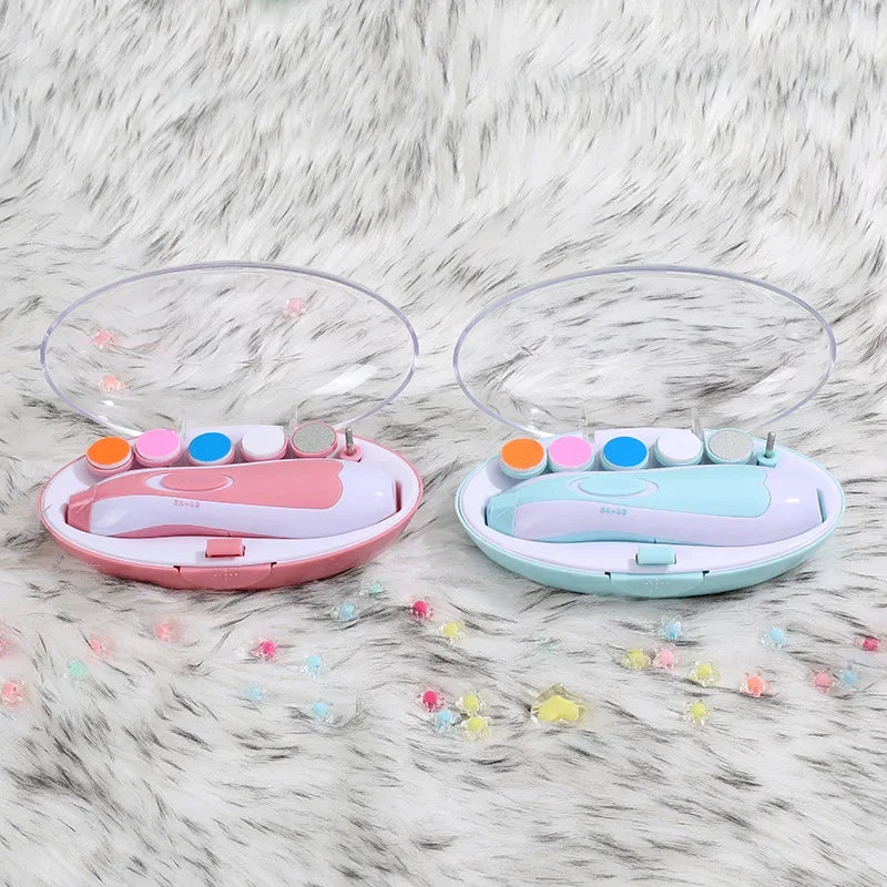 Pink and Blue teal Electric baby trimmer safe shown in case with different trimmer pad options side by side