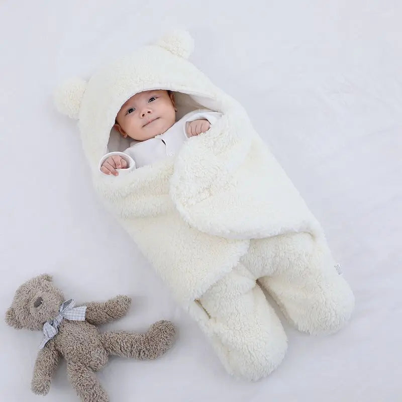 Cute and cuddly white baby bear blanket with baby wrapped up cozy showing little hands versatile for baby's temperature comfort 