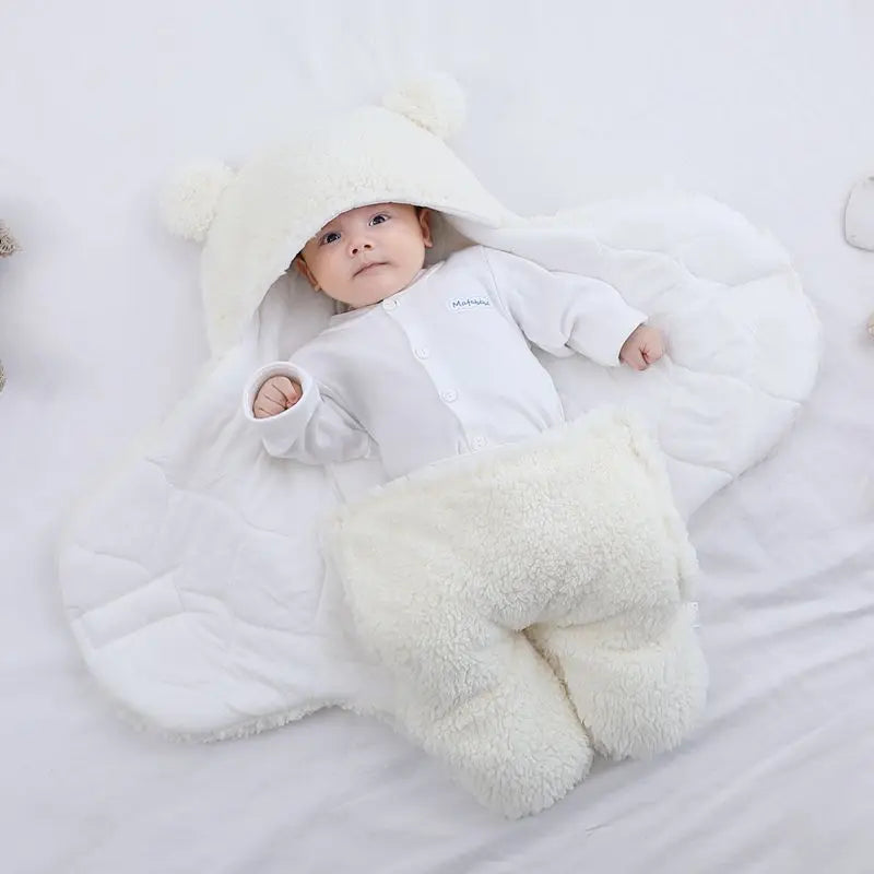 Cute and cuddly white baby bear blanket with baby wrapped up cozy with arms outstretched versatile for baby's temperature comfort 
