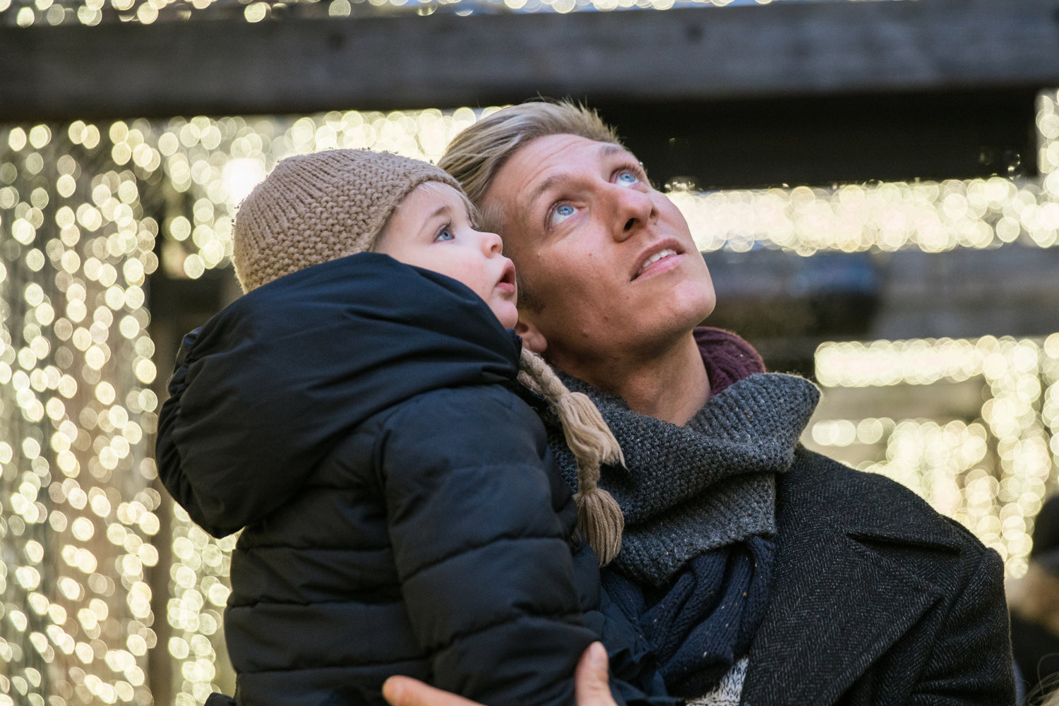 Father Dad holding child looking up 